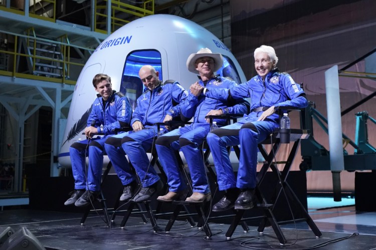 Oliver Daemen, from left, Mark Bezos, Jeff Bezos, founder of Amazon and space tourism company Blue Origin, and Wally Funk participate in a post-launch briefing at the spaceport near Van Horn, Texas, on July 20.

