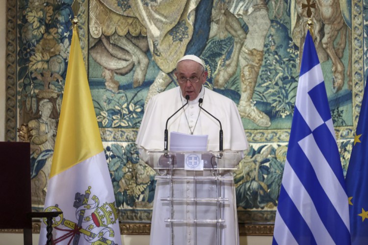 Pope Francis delivers a speech during a meeting with authorities at the Presidential Palace in Athens on Saturday.

