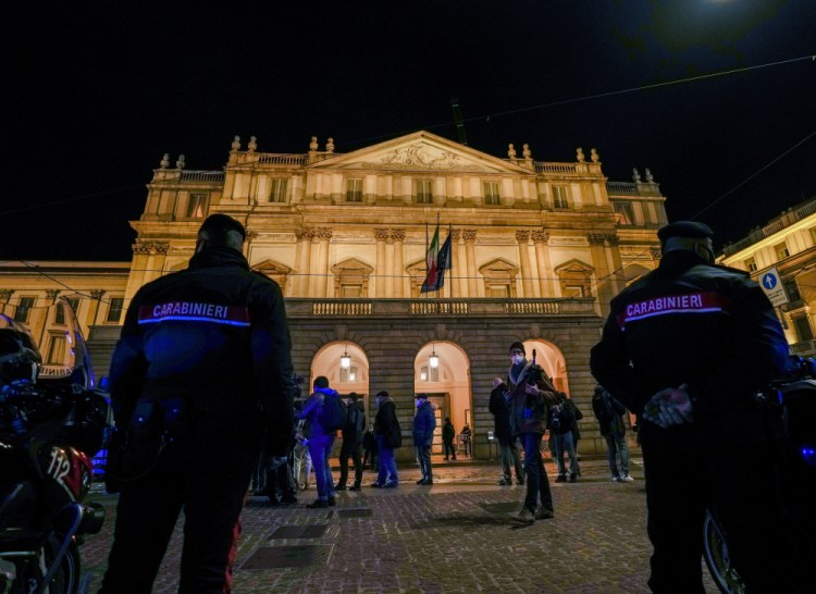 Italian Carabinieri police patrol outside La Scala opera house for the premiere of Verdi's "Macbeth" in Mila on Tuesday. 

