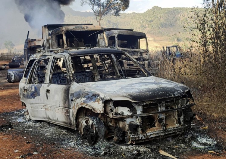 Vehicles smolder in Hpruso township, Kayah state, Myanmar, on Friday. 