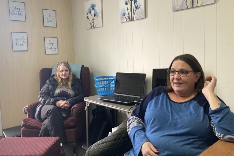 Anne Muilenburg, right, and Debra Cross in Muilenburg's office in Provoking Hope, a recovery center in McMinnville, Ore. Muilenburg, a recovering opioid addict, is the rehab's office manager.  
She said funds from the settlement can address the community's drug dependency. 