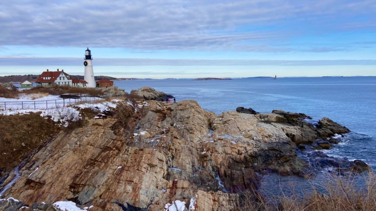The view Friday of Portland Head Light, looking north from an earthen berm in Fort Williams Park where the town of Cape Elizabeth plans to extend a walkway and railing to create a safer ocean overlook.