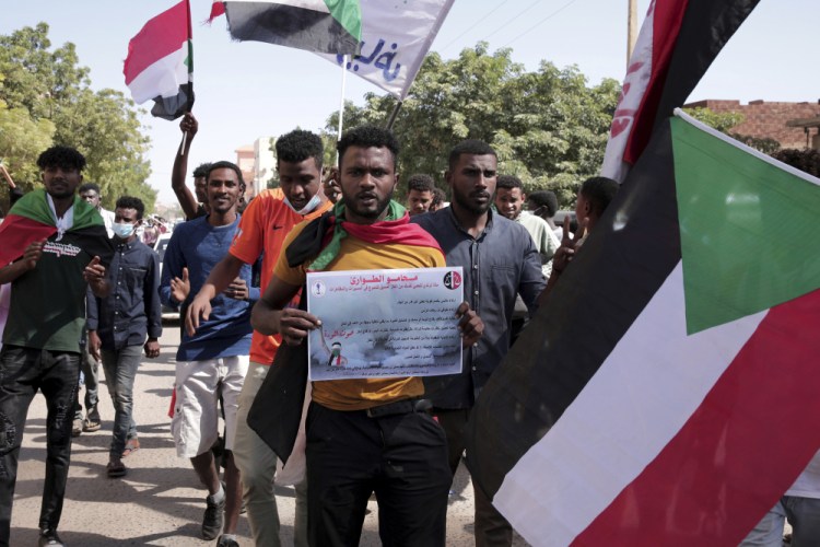 People protest to denounce the October military coup, in Khartoum, Sudan, on Saturday.