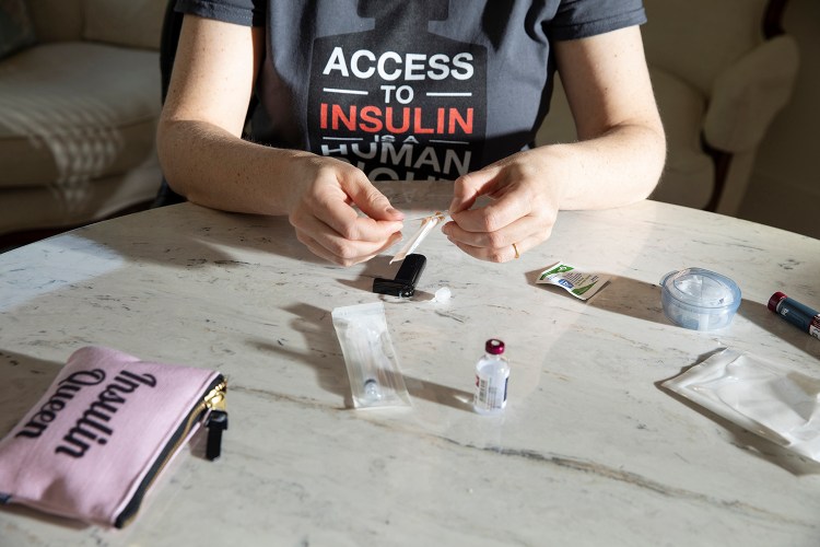 Lija Greenseid prepares to draw insulin at her home in St. Paul, Minn. More than 7 million Americans depend on insulin to keep their bodies functioning, according to the American Diabetes Association. MUST CREDIT: Photo for The Washington Post by Jenn Ackerman
