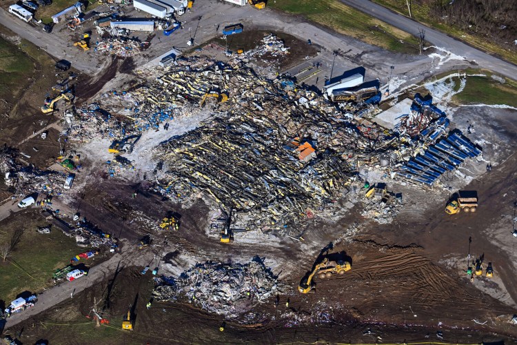 An aerial view on Sunday of Mayfield Consumer Products, the tornado-destroyed candle factory in Mayfield, Ky., where eight people died. Experts said the tornado-specific requirements facing the factory, which opened in 1991, may have been minimal. 