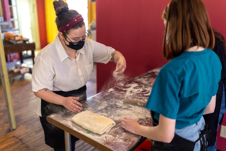 Portland chef Jasmine Mason, left, leads a croissant-making class at Bravo Maine! earlier in January. Bravo Maine! offers cooking classes of all sorts, teaching skills as varied as making sushi or macarons or pasta. 