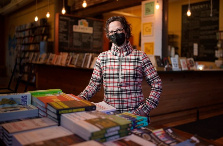 Katie Pinard, co-owner of Elements: Books Coffee Beer in Biddeford, requires vaccines and boosters for employees, and masks for customers and staff. She purchased KN95 masks for her 14 employees and tries to keep rapid tests on hand. “Is it affecting financials? A little bit. Is it worth it? Absolutely,” she said.