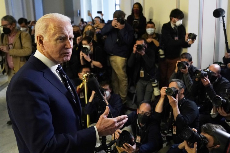 President Biden speaks to the media after meeting privately with Senate Democrats on Thursday on Capitol Hill in Washington. The past week crystallized that, at least in the current political, economic and foreign policy environment, Biden is struggling to shape events and instead is finding himself shaped by them.
