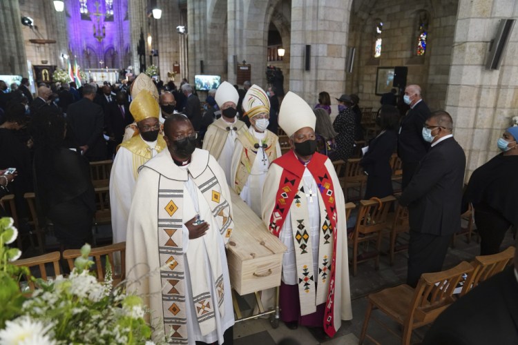 The coffin is carried out at the end of the funeral service for Anglican Archbishop Emeritus Desmond Tutu in St. George's Cathedral in Cape Town, South Africa, on Saturday,. 
The activist for racial equality and LGBT rights died Dec. 26 at 90. 

