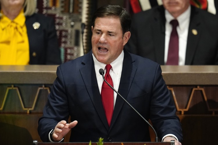 Arizona Republican Gov. Doug Ducey gives his state of the state address at the Arizona Capitol, in Phoenix. Former President Donald Trump is stepping up his election-year effort to dominate the Republican Party with a Saturday rally in Arizona. 