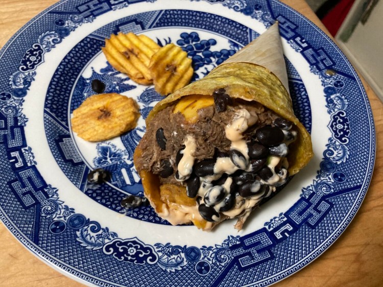 A Caribbean Cone from Tostones Cafe in Cape Elizabeth is fried plantain in the form of  cone, filled with shredded beef, avocado, sweet plantain, black beans and sour cream, among other things.