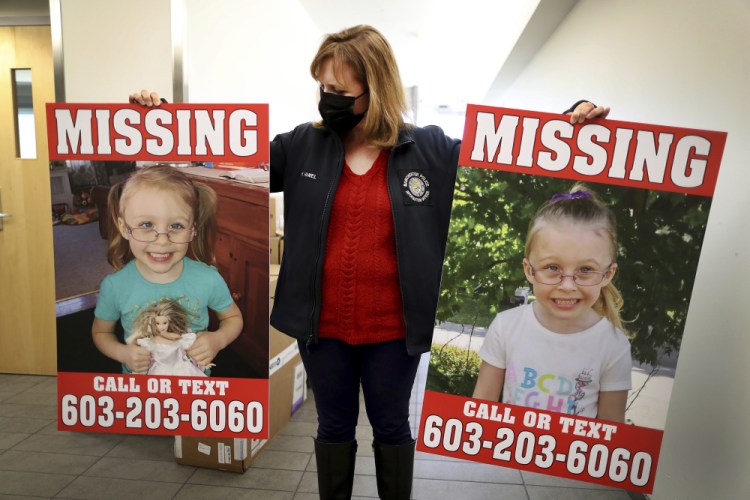 Manchester Police Public Information Officer Heather Hamel holds two reward posters, Tuesday in Manchester, N.H., that show missing girl Harmony Montgomery. The father of the young girl, Adam Montgomery, 31, of Manchester, has been arrested on second-degree assault, custody and child endangerment charges regarding his daughter, but the search for her continues.