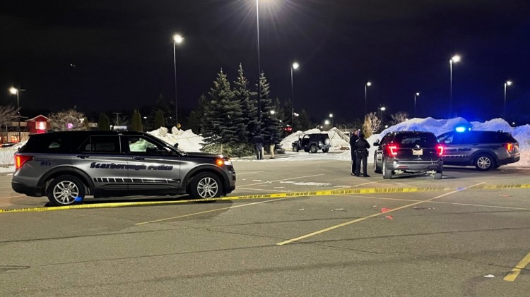 Police work at the scene of the shooting Wednesday night in the parking lot of the Walmart in Scarborough.