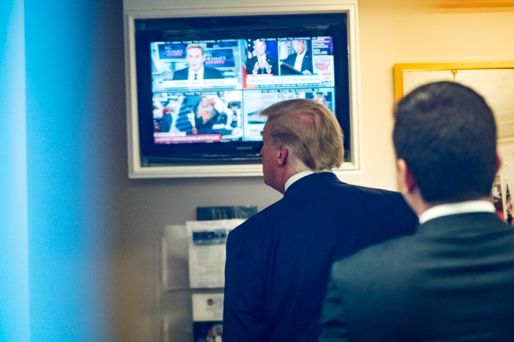 President Trump watches a television in the lower press office after delivering remarks in the James S. Brady Press Briefing Room at the White House, on Nov. 20, 2020.