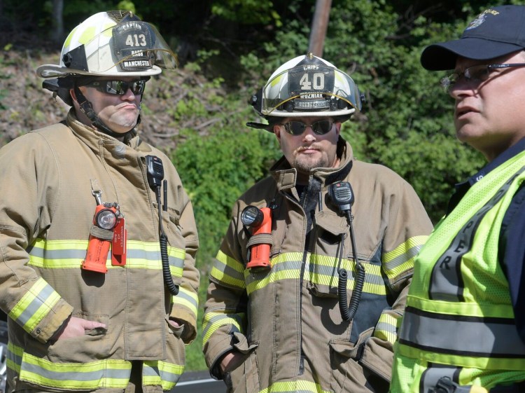 HALLOWELL, ME - JULY 6: Manchester Fire Chief Frank Wozniak, center, at an accident Tuesday August 6, 2019 on Route 201 in Hallowell.Staff photo by Andy Molloy