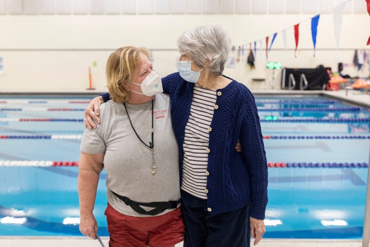 Riverton Community Center lifeguard and swim instructor Jeannette Strickland, left, and Marcia Howell, a regular swimmer at the pool, pose together Friday. Strickland rescued Howell when she had a heart attack while swimming in December.