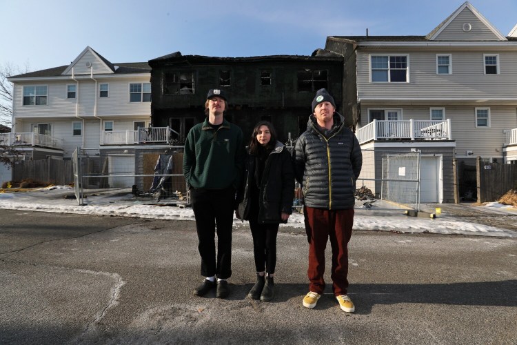 Roommates Henry Shroder, left, Louisa Goldman, Tucker Wanzer and Megan Lowe (not shown) lost all of their belongings when their apartment was destroyed by a large fire on North Street on Munjoy Hill in late January. They are now trying to find a new place to live. 
