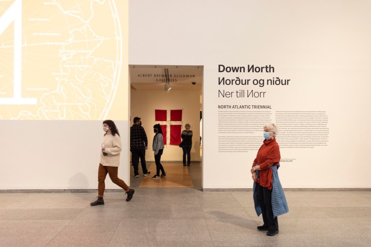 Museum-goers look at work in "Down North," the inaugural North Atlantic Triennial, on display at the Portland Museum of Art through June.