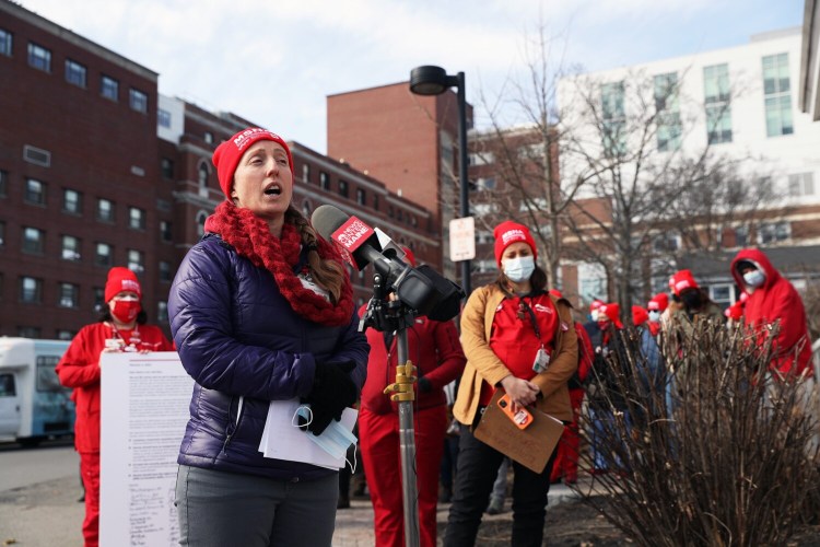 Lucy Dawson, a member of the Maine State Nurses Association -- a union that represents workers at Maine Medical Center -- speaks to reporters during a protest against working conditions in the emergency department. The union cites abuse from patients for decades as one of their concerns. 