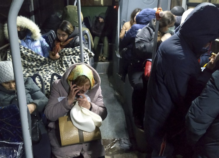 People wait in a bus Friday to be evacuated to Russia from Donetsk, the territory controlled by pro-Russian militants in eastern Ukraine.