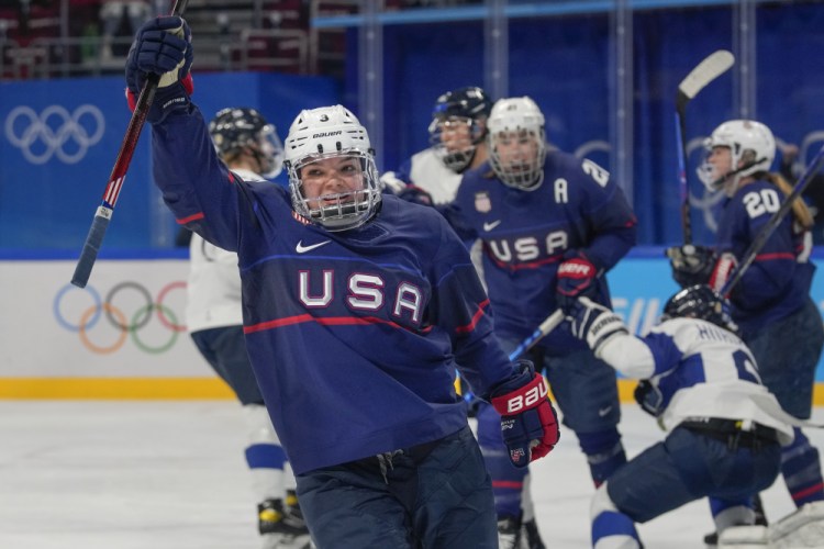 Cayla Barnes (3) celebrates after scoring a goal against Finland during a women's semifinal hockey game. 