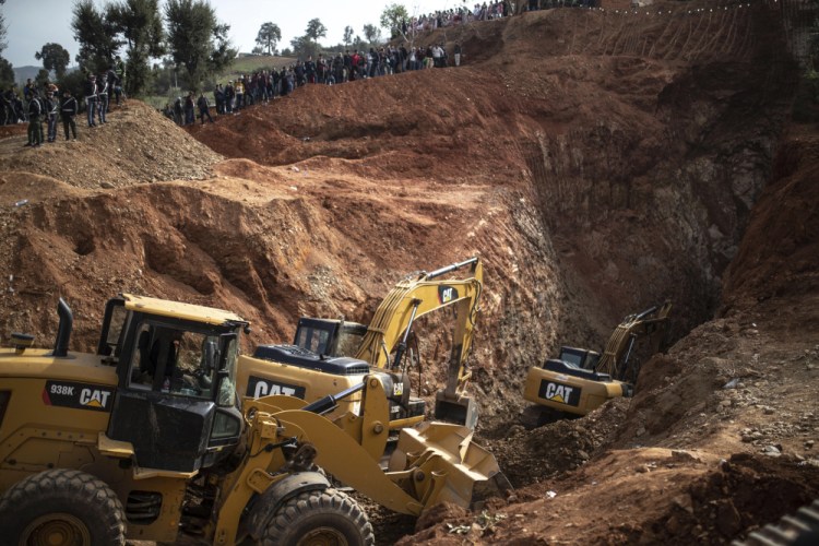 Tractors dig through a mountain Friday as they take part in the rescue mission of a 5-year-old boy who fell into a well in the northern village of Ighran in Morocco's Chefchaouen province.