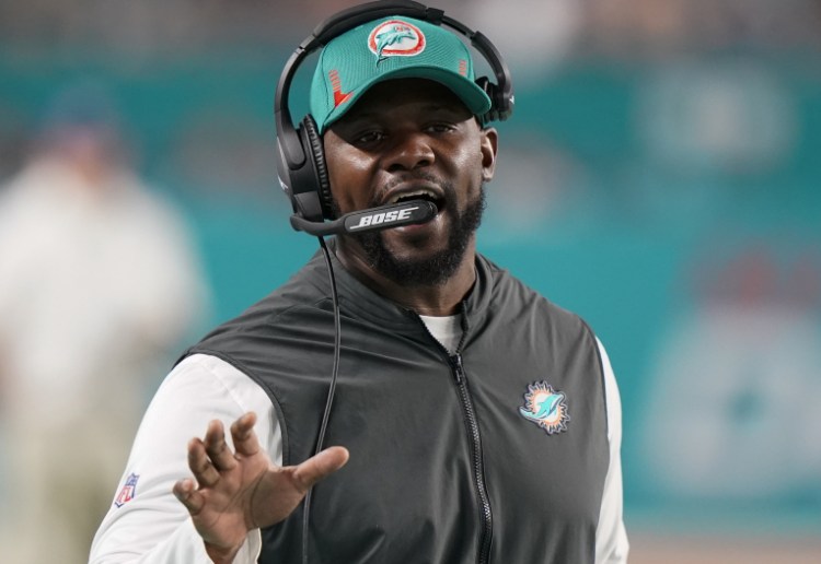 Miami Dolphins coach Brian Flores directs his team in its season-ending win over the New England Patriots on Jan. 9.