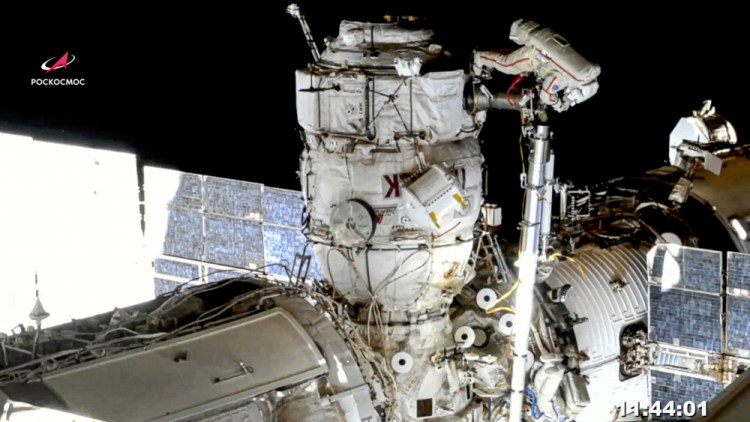 In this image taken from Roscosmos video, Russian cosmonauts Oleg Novitsky, top, and Pyotr Dubrov, bottom, members of the crew to the International Space Station (ISS), perform their first spacewalk on Wednesday, June 2, 2021, to replace old batteries.