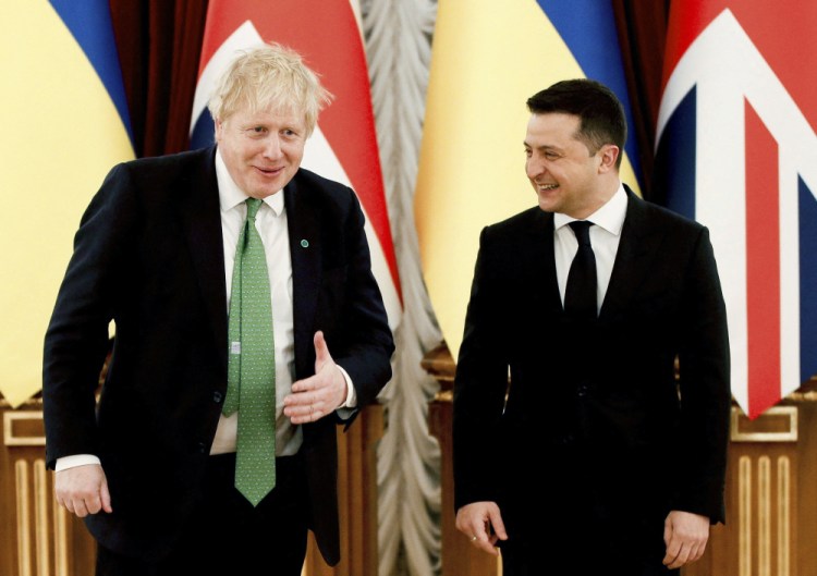 Britain's Prime Minister Boris Johnson, left, speaks with Ukrainian President Volodymyr Zelenskyy prior to their talks about rising tension between Ukraine and Russia, at the presidential palace in Kyiv, Ukraine, on Tuesday. 