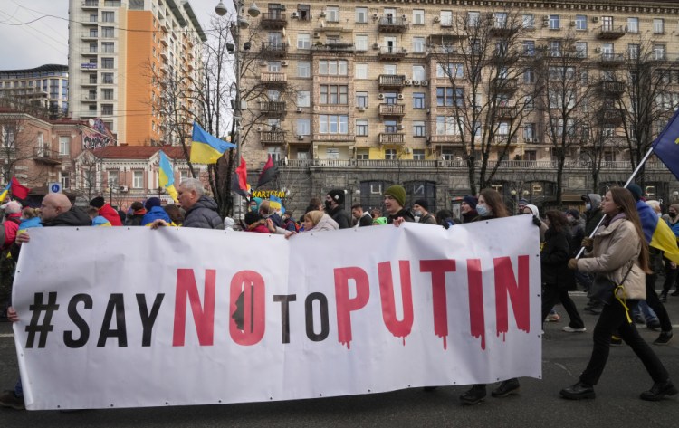 Ukrainians attend a rally in central Kyiv, Ukraine, Saturday during a protest against the potential escalation of the tension between Russia and Ukraine. 