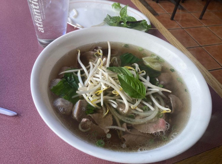 Que Huong's Pho Xe Lua comes chock full of Vietnamese meatballs, tender flank steak and rare eye of round. Customize your bowl with garnishes and condiments.