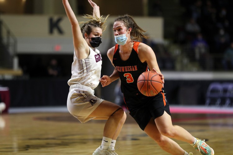 Skowhegan High's Jaycie Christopher maneuvers around Greely's Asia Kelman during the Class A girls' basketball state championship game Saturday at the Cross Insurance Arena in Portland. Christopher scored 24 points in the River Hawks' 60-46 victory.