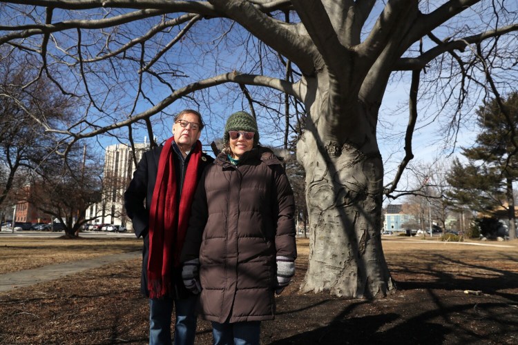 Anna Noyes Benoit, right, and her brother Nicholas Noyes stand under a beech tree that was planted by their great-great-great-grandfather, in a park they've always known as Noyes Park but now goes by the name of Bedford Park. Members of the Noyes family are asking the city to change the name to Noyes Park.
