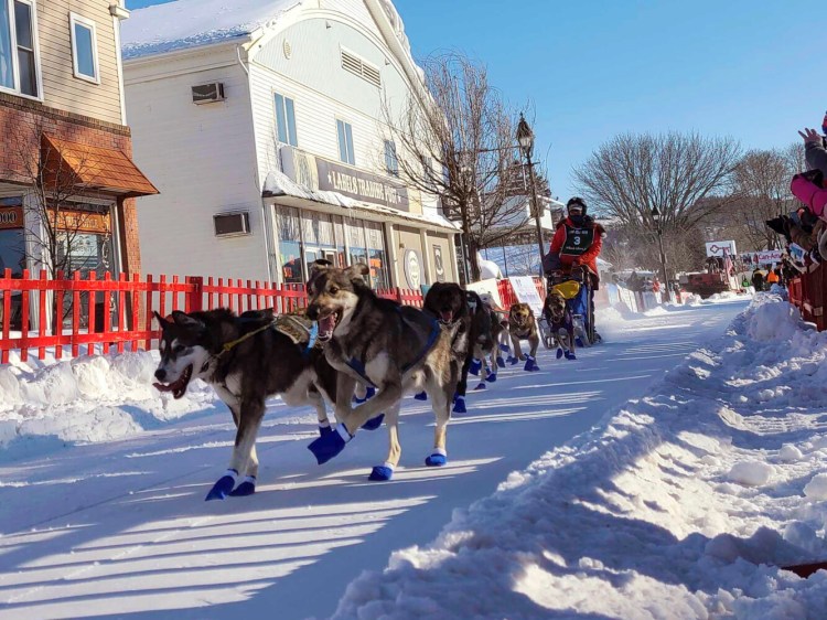 Patty Richards from Vermont takes off with her team of sled dogs at the start of the Can-Am 100 Saturday in Fort Kent.