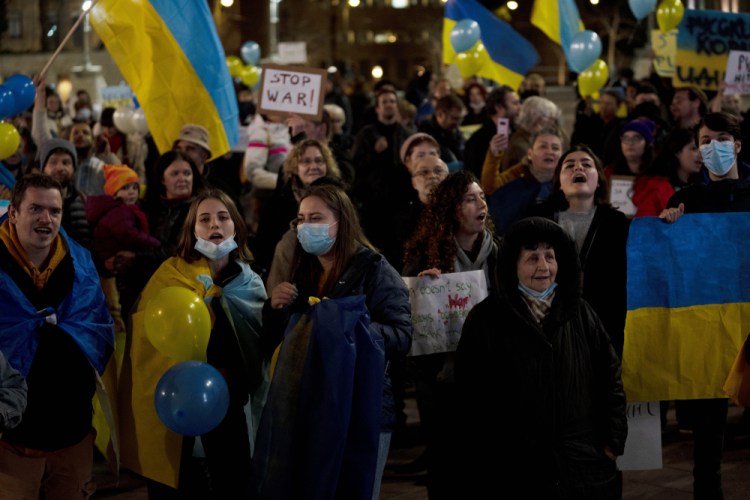 Ukranians and their supporters protest against Russia's invasion of Ukraine, in central Jerusalem, Monday. 