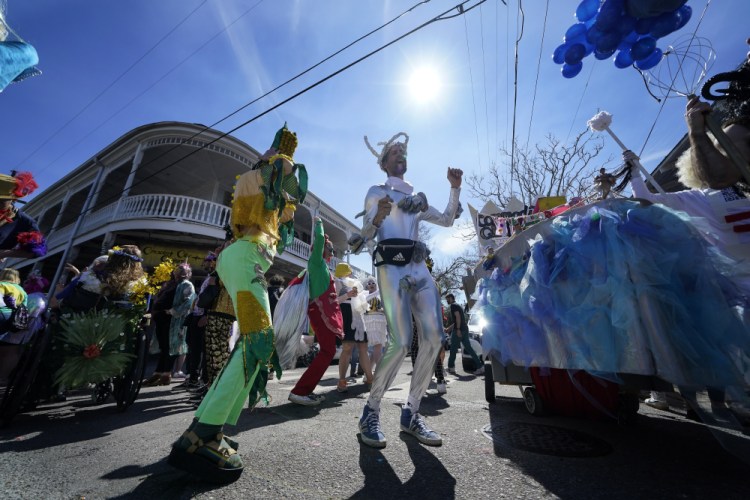 A person marches in the Societe de Sainte Anne parade during Mardi Gras on Tuesday in New Orleans. 

