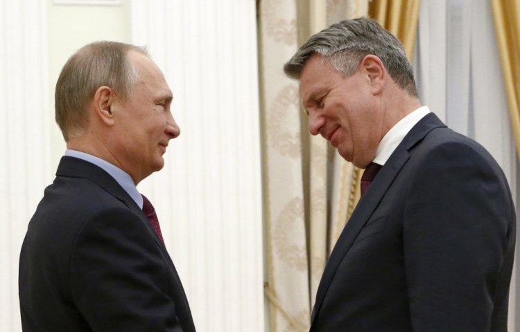 Russian President Vladimir Putin, left, meets with CEO of Royal Dutch Shell Ben van Beurden in Moscow in June 2017.