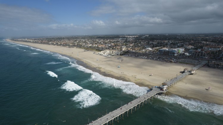 A coyote attacked and seriously injured a girl on Southern California's famed Huntington Beach, police said.