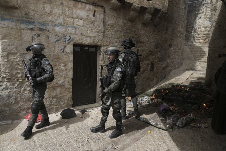 Israeli police is deployed in the Old City of Jerusalem, Sunday. Israeli police clashed with Palestinians outside Al-Aqsa Mosque after police cleared Palestinians from the sprawling compound to facilitate the routine visit of Jews to the holy site and accused Palestinians of stockpiling stones in anticipation of violence.