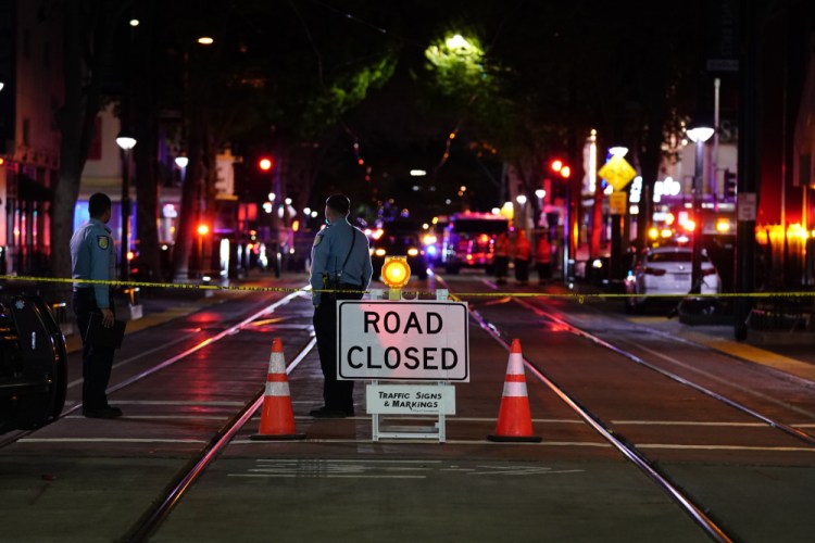 A roadblock is set a block away from the scene of an apparent mass shooting in Sacramento, Calif., on Sunday. 