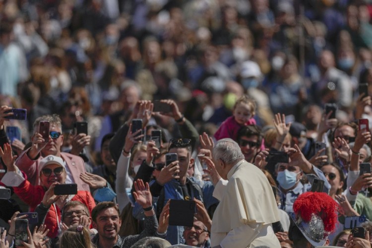 Pope Francis drives through a crowd of the faithful at the end of the Mass he led in St. Peter's Square at the Vatican on Sunday.