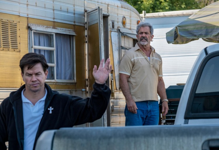 Mark Wahlberg, left, and Mel Gibson in "Father Stu."