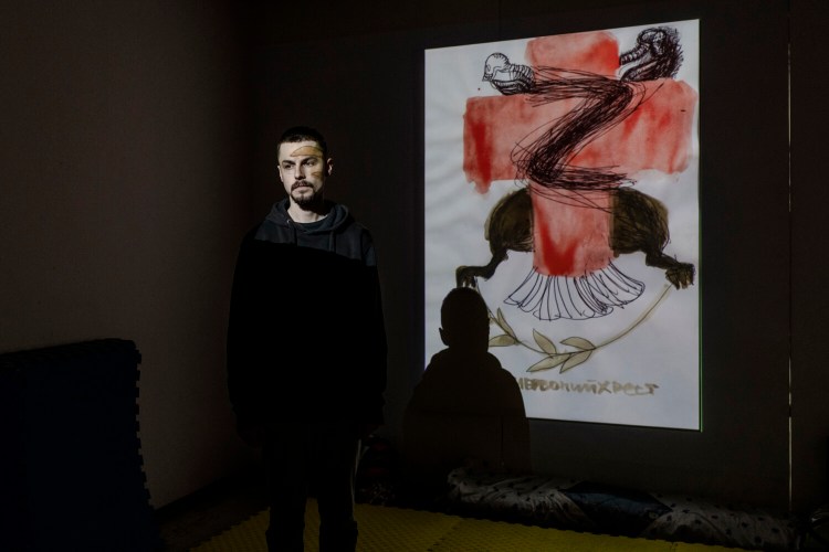 Stepan Burban, a 27-year-old rapper insisted on using one of the art works done recently by Kyiv artist Vlada Ralko as his new album cover as a way of coping and expressing anger connected to the current invasion. MUST CREDIT: Photo for The Washington Post by Kasia Strek.