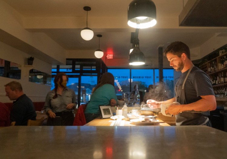Judy Gibson chef Chris Wilcox plates a dish at his South Portland restaurant. 