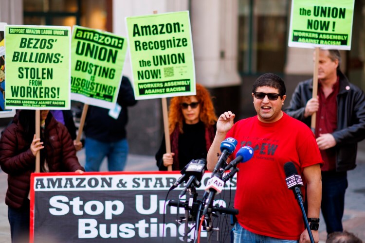 Amazon JFK8 distribution center union organizer Jason Anthony speaks to media on April 1 in New York. The Staten Island warehouse pulled off a surprise win, but the next step, ironing out a contract through bargaining, is already being delayed. 
