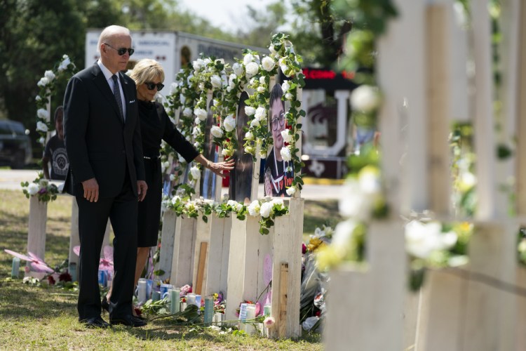 President Biden and first lady Jill Biden visit a memorial at Robb Elementary School to pay their respects to the victims of the mass shooting Sunday in Uvalde, Texas.