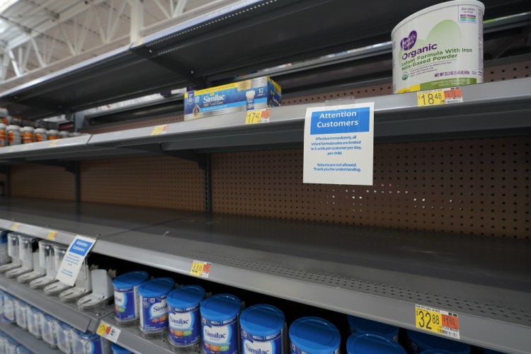 Shelves typically stocked with baby formula sit mostly empty at a store in San Antonio on May 10. Ninety-eight percent of formula is manufactured domestically and four companies account for roughly 90 percent of the market: Abbott, Reckitt, Nestle and Perrigo.