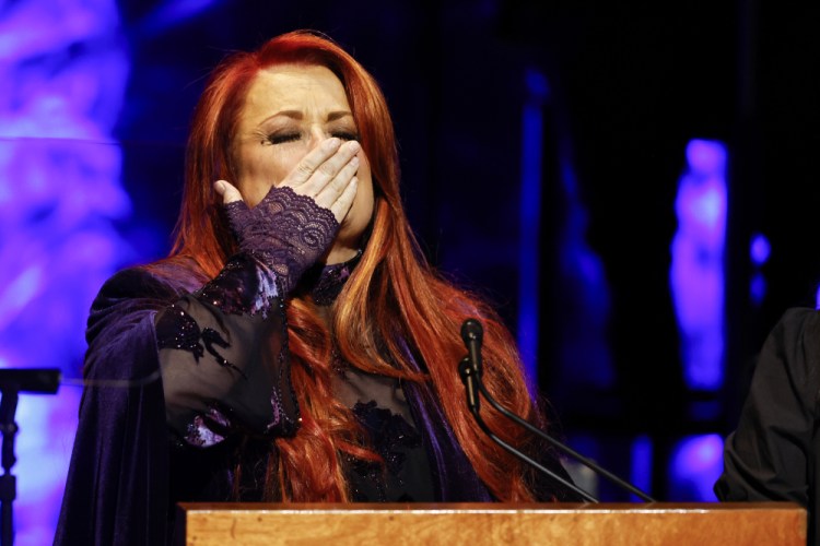 Wynonna Judd blows a kiss to attendees during the Medallion Ceremony at the Country Music Hall Of Fame Sunday in Nashville, Tenn. (Photo by Wade Payne/Invision/AP)