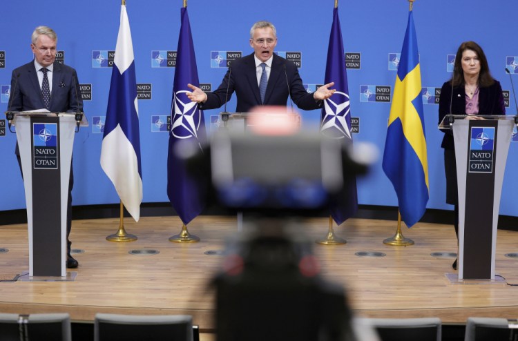 NATO Secretary General Jens Stoltenberg, center, participates in a media conference with Finland's Foreign Minister Pekka Haavisto, left, and Sweden's Foreign Minister Ann Linde at NATO headquarters in Brussels on Jan. 24. After remaining firmly against NATO membership for decades, polls show more than 70 percent of Finns and about 50 percent of Swedes now favor joining.