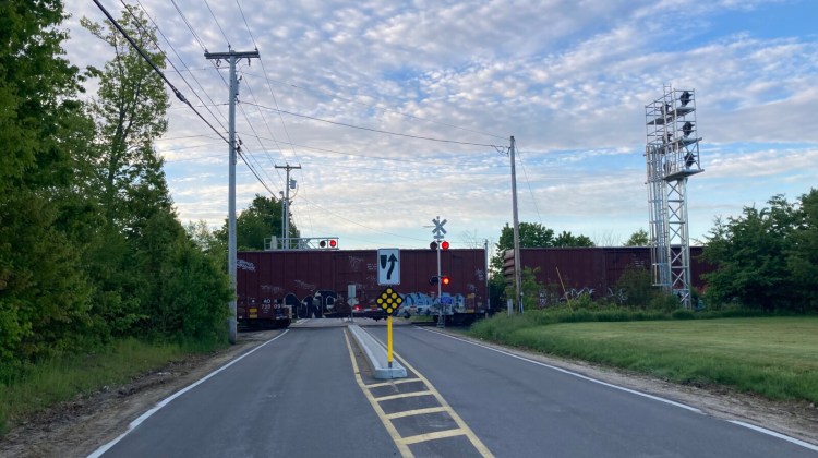 A freight train blocks Greely Road in Cumberland early Sunday morning.